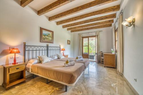 a bedroom with a large bed in a room at Ideal Property Mallorca - Sa Pleta in Petra
