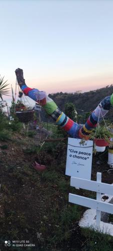 a sign on a hill with a sign on a bench at Agrifazenda in Cogoleto