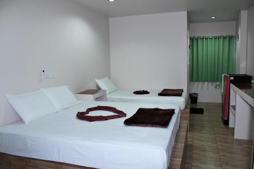 Ліжко або ліжка в номері Sairee Center Guest House