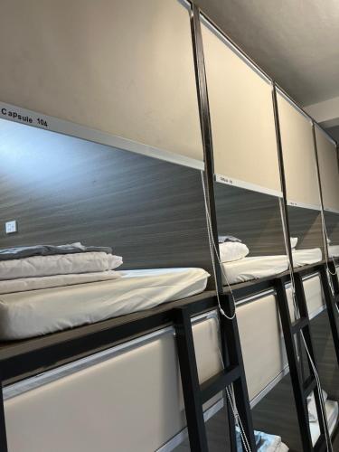 a group of bunk beds in a dorm room at 8h-hostel in Ho Chi Minh City