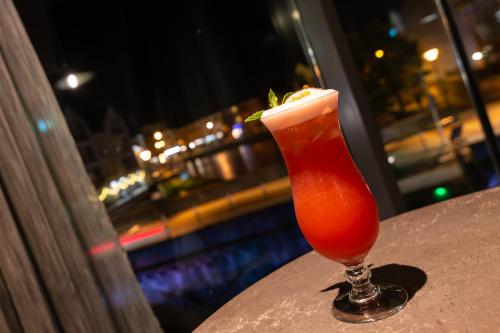 a drink in a glass sitting on a table at The Glasshouse in Sligo