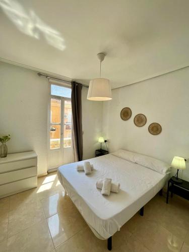 En eller flere senge i et værelse på Ruzafa Vibes Apartments