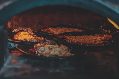 a group of food cooking in an oven at Costa Azul Ecolodge in Aquitania