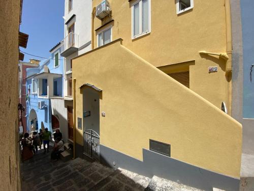 a group of people sitting outside of a building at "La Terrazza" Corricella in Procida