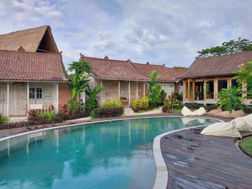 an image of a swimming pool in a villa at Spaces Bali in Dalung