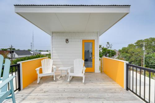 a porch with two chairs and a table on it at Coastal North Carolina Abode - Rooftop Water Views in Morehead City