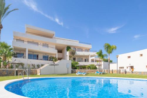 een villa met een zwembad voor een gebouw bij Marbella Mountain With Sea View And Pool - Happy Rentals in Marbella