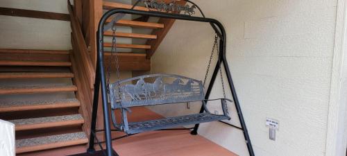 a metal staircase in a room next to a stair case at Hot Springs Inn in Ouray