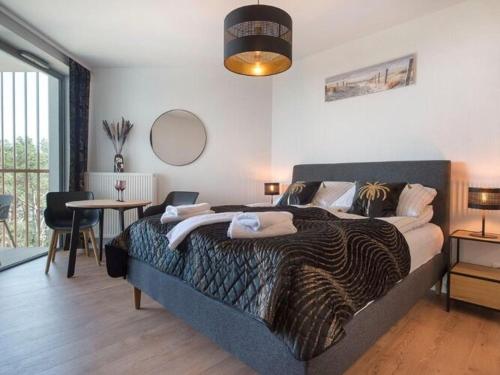 Ένα ή περισσότερα κρεβάτια σε δωμάτιο στο Luxurious apartment for 3 people in Pobierowo