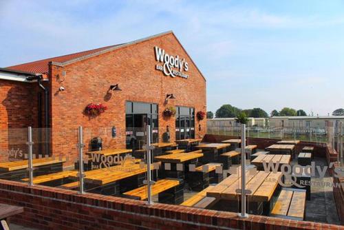 a building with tables and benches outside of it at Amber’s Get Away in Skegness