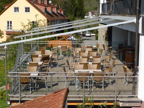 a group of chairs sitting on a patio with a building at Zum Kaiserwirt in Heppenheim an der Bergstrasse