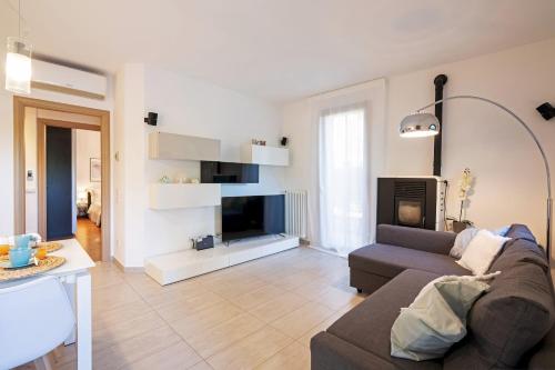a living room with a couch and a fireplace at Martilla in Gabicce Mare