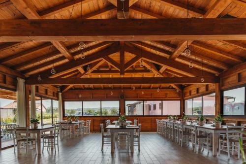 a dining room with tables and chairs in a building at Agriturismo il Laghetto in Grosseto