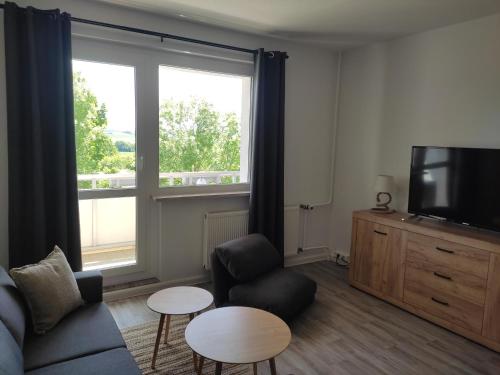 TV a/nebo společenská místnost v ubytování Gästewohnung in Hohenstein-Ernstthal