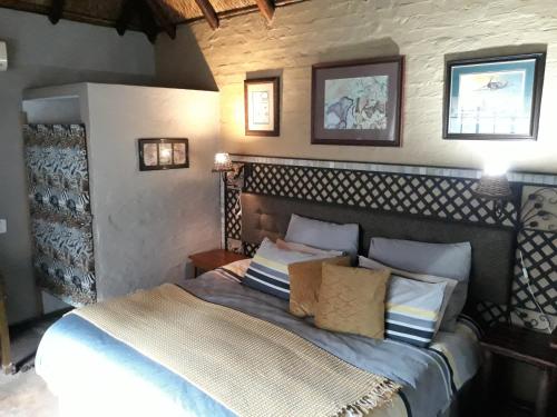 Voodi või voodid majutusasutuse African Silhouette Guesthouse toas