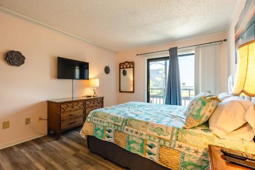 a hotel room with a bed and a window at Ocean View All-New Beach Suite at Tilghman Top Location in Myrtle Beach