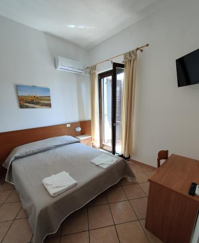 Ein Bett oder Betten in einem Zimmer der Unterkunft Hotel Acciaroli