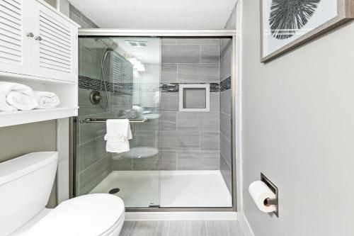 a bathroom with a shower and a toilet at Edgewater West 63 in Gulf Shores