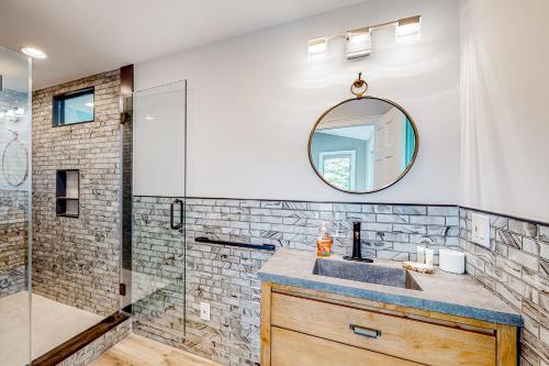 a bathroom with a sink and a mirror at Bourne Glen in Bourne