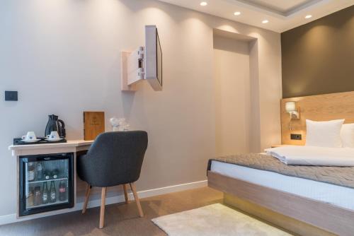 Ένα ή περισσότερα κρεβάτια σε δωμάτιο στο Emilia Lux Rooms