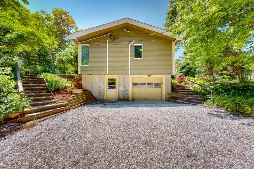 a house with a garage and a gravel driveway at Bourne Glen in Bourne
