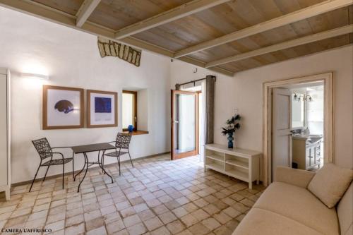 a living room with a couch and a table at Casa Mimina in Ischia