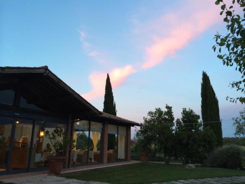 a villa with a view of the sky at Villa Acquaviva Wine Resort in Montemerano