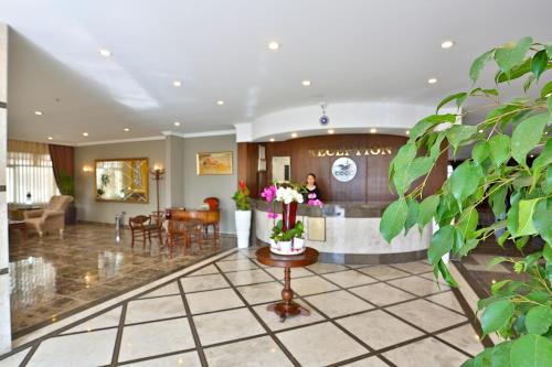 a lobby of a hotel with a reception desk at Hotel Bon Garden City in Silivri