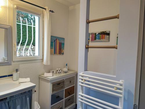 a bathroom with a sink and a mirror at Les Pitounus in Les Arcs sur Argens