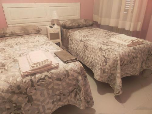 Posteľ alebo postele v izbe v ubytovaní traivicolidifoligno