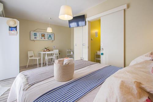 a bedroom with a bed with a basket on it at Apartments Prgomet in Makarska