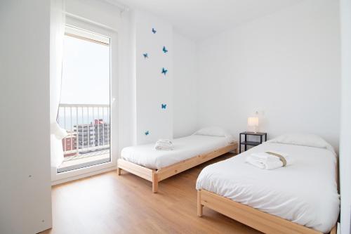 Posteľ alebo postele v izbe v ubytovaní Global Properties, Apartamento con terraza y vistas al mar