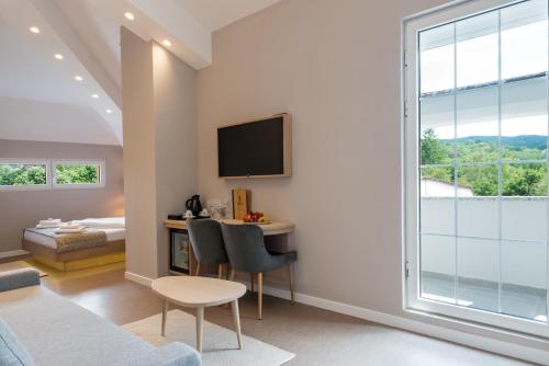 Ένα ή περισσότερα κρεβάτια σε δωμάτιο στο Emilia Lux Rooms