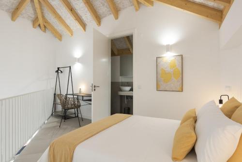 Postel nebo postele na pokoji v ubytování Madalena Village 1 - City centre by HD PROPERTIES