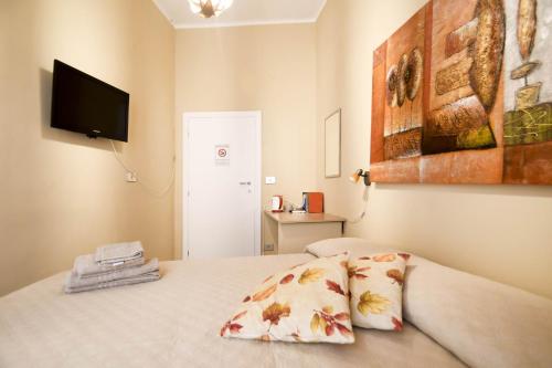 Postel nebo postele na pokoji v ubytování B&B La Pianedda