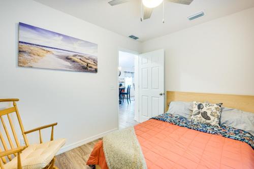 a bedroom with a bed and a chair in it at Newly-Built Home with Yard and Patio in Inverness! in Inverness