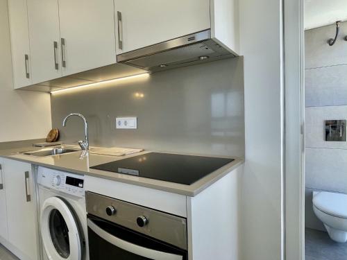A kitchen or kitchenette at CAP CASTELL 8-A