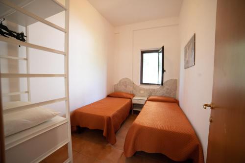 Postel nebo postele na pokoji v ubytování I Sapori Del Gargano