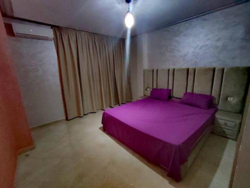 Postel nebo postele na pokoji v ubytování Marrakech