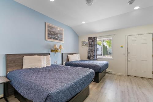 Postel nebo postele na pokoji v ubytování Ne'r Beach Motel