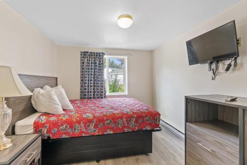 Postel nebo postele na pokoji v ubytování Ne'r Beach Motel