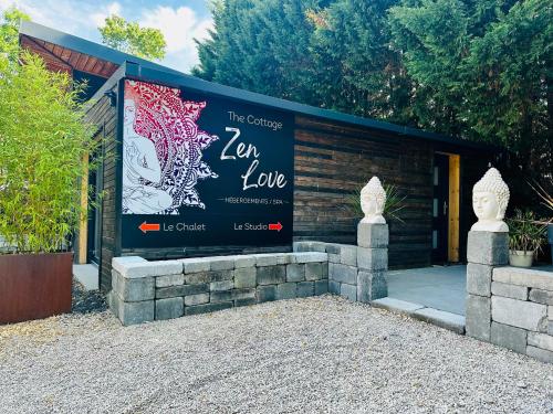 a sign in front of a building at LE COTTAGE Zen LOVE in Foucherans
