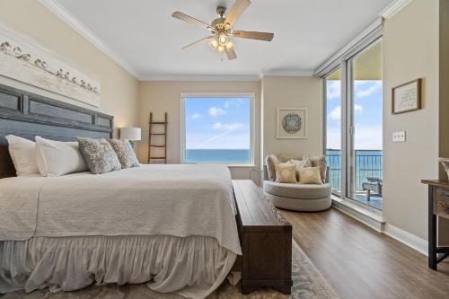 a bedroom with a bed and a view of the ocean at Indigo East 1004 in Perdido Key