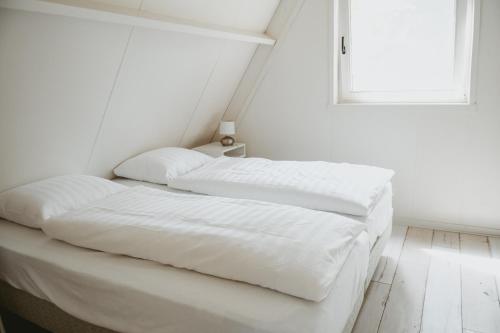 Boshuisje Rekem - Luka tesisinde bir odada yatak veya yataklar