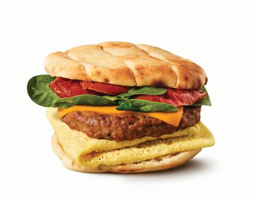 a large hamburger with cheese and meat and lettuce at Aloft Atlanta Downtown in Atlanta