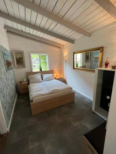 En eller flere senger på et rom på Romantische Holzhütte für zwei