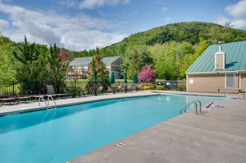 a swimming pool with a mountain in the background at Relaxing Lincoln Condo with Fireplace and Shuttle in Lincoln