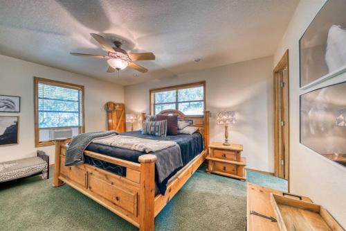 a bedroom with a bed and a ceiling fan at Perk Canyon Hidden Acres-Hot Tub-Gas Fireplace in Ruidoso