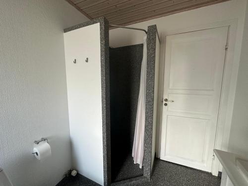 a mirror in the corner of a room with a door at Great apartment with sea view & balcony in Tórshavn