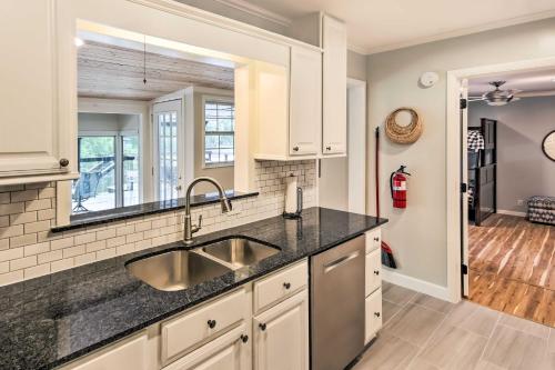 a kitchen with a sink and a mirror at Modern Lakefront Home with Dock, Deck and Boat Slip! in Eucha